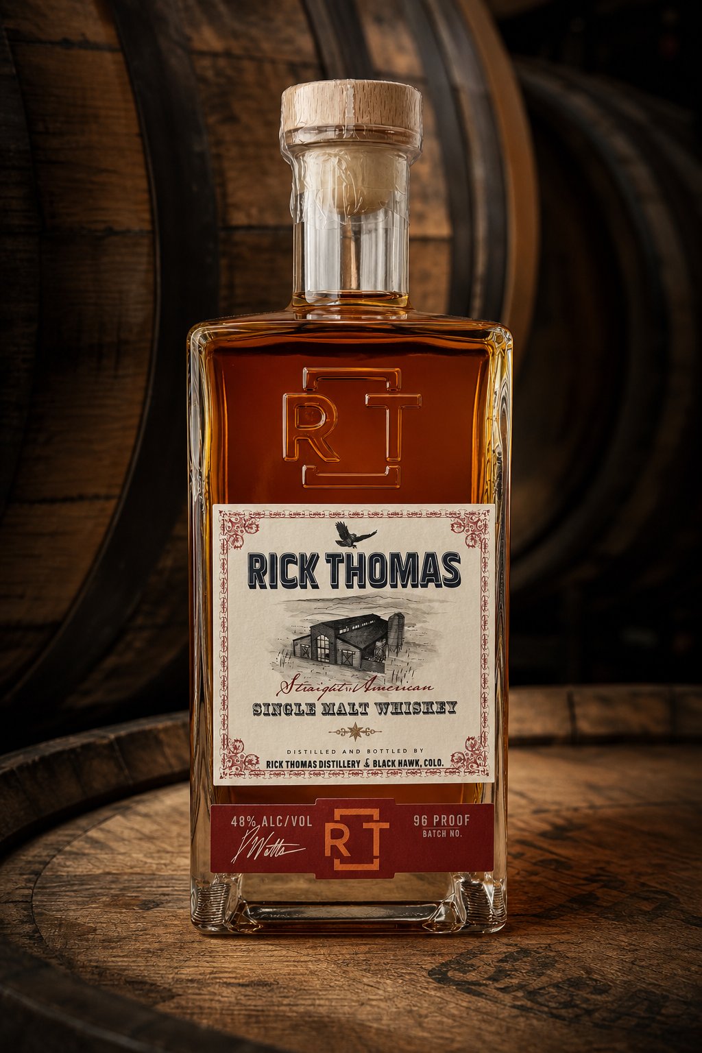 Rick Thomas Single Malt Whiskey among stenciled barrels
